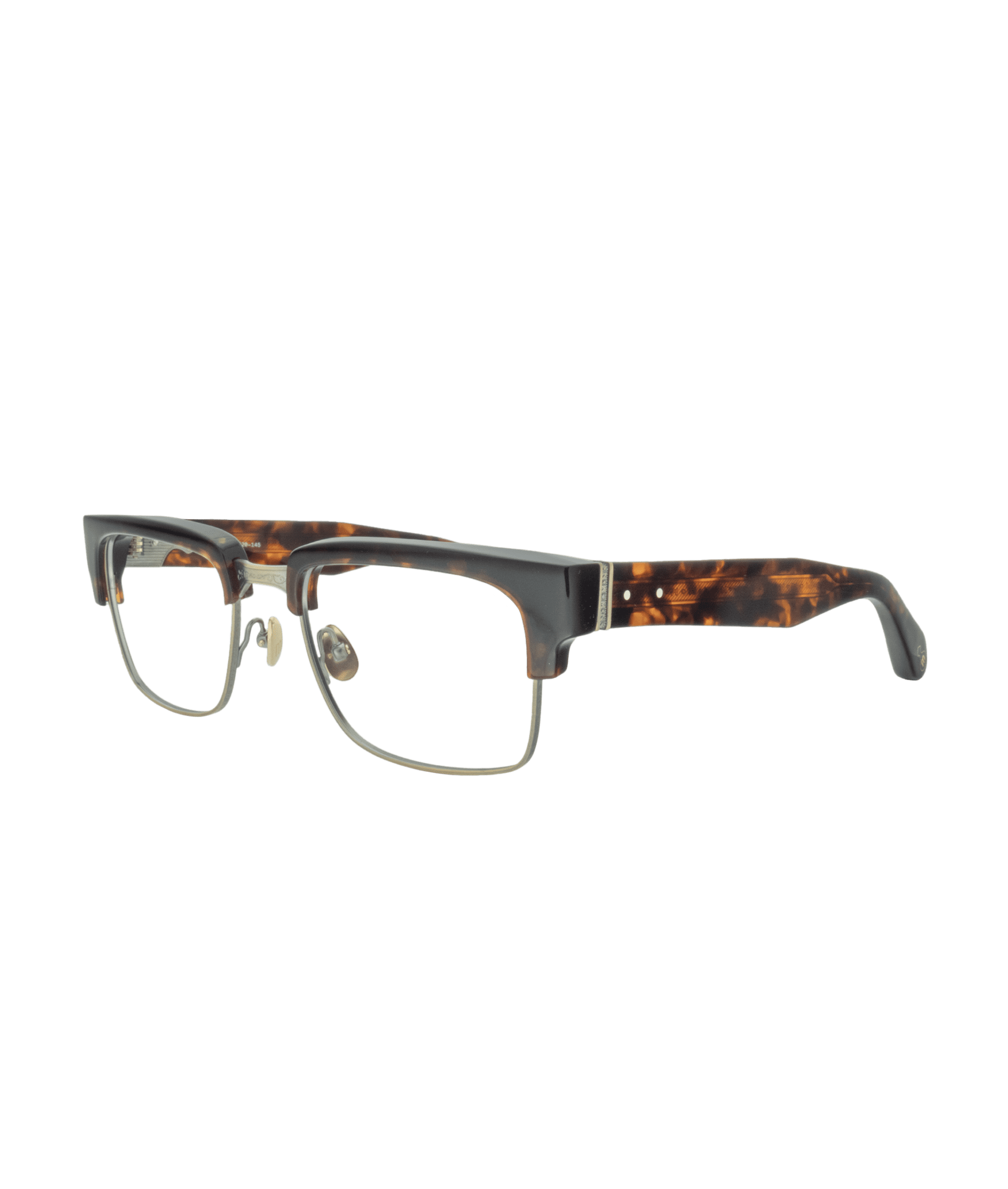 This frame reflects Japanese craftsmanship, with delicate hand-engraved details on the bridge and sides. Its classic yet bold design exudes personality, softened by the brown hue accented with touches of gold. A refined frame that perfectly balances character and elegance.